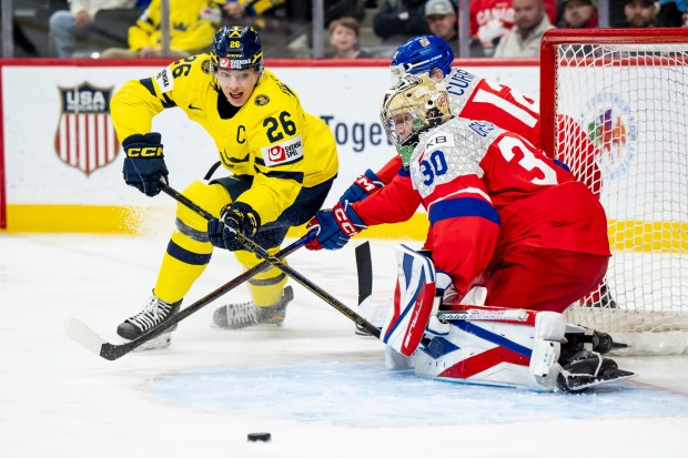 Sweden's Jack Berglund, 26, shoots on Czechia goaltender Michal Orsulak during the IIHF World Junior Hockey Championship final in St. Paul on Monday, Jan. 5, 2026. (Christopher Katsarov/The Canadian Press via AP)