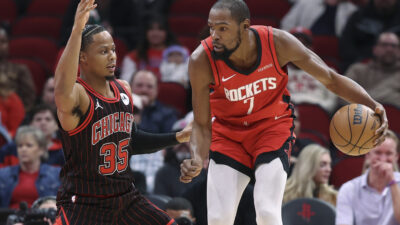 Jan 13, 2026; Houston, Texas, USA; Houston Rockets forward Kevin Durant (7) controls the ball as Chicago Bulls forward Isaac Okoro (35) defends during the first quarter at Toyota Center.