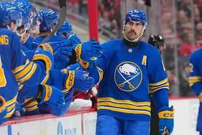 Buffalo Sabres forward Alex Tuch celebrates a goal with teammates at the bench