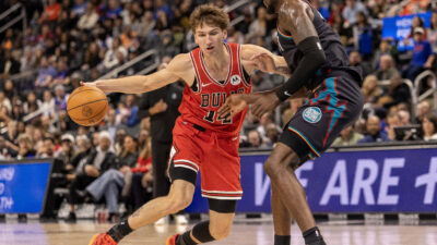 Nov 12, 2025; Detroit, Michigan, USA; Detroit Pistons forward Paul Reed (7) defends against Chicago Bulls forward Matas Buzelis (14) during the second half at Little Caesars Arena.