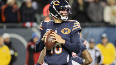Dec 20, 2025; Chicago, Illinois, USA; Chicago Bears quarterback Caleb Williams (18) looks to throw a pass against the Green Bay Packers during the first quarter at Soldier Field. Mandatory Credit: Mike Dinovo-Imagn Images