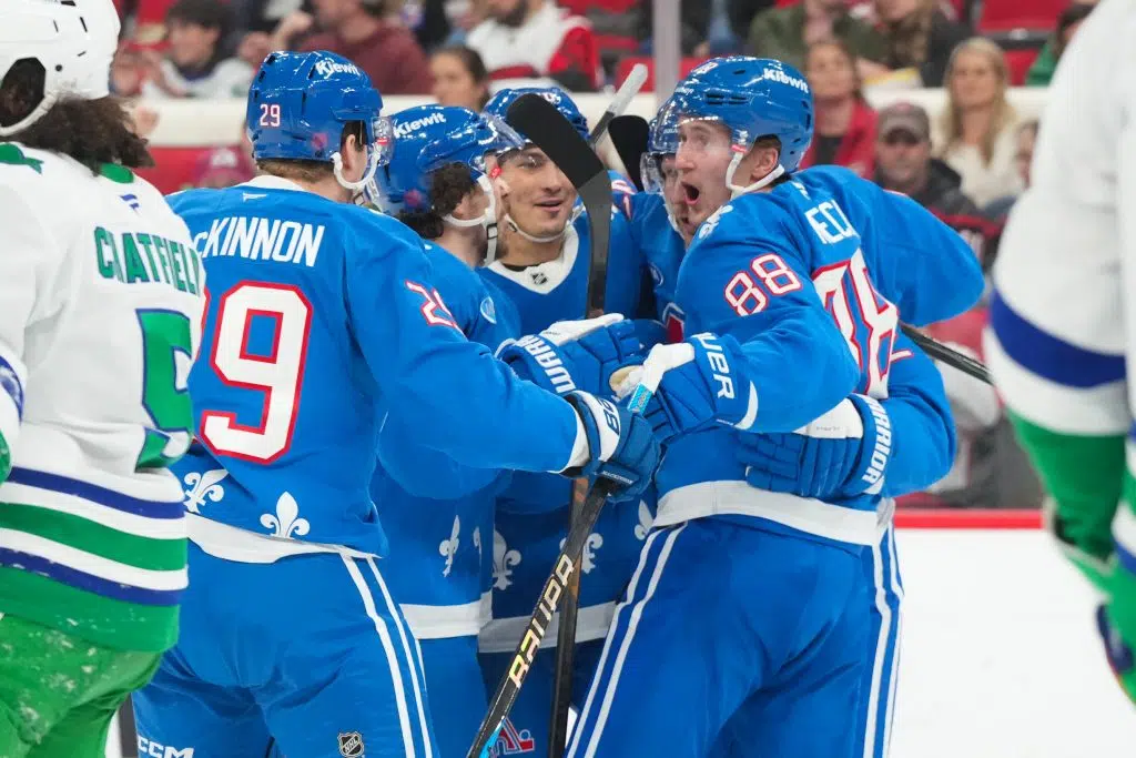 Jan 3, 2026; Raleigh, North Carolina, USA; Colorado Avalanche left wing Gabriel Landeskog (92) celebrates with center Martin Necas (88), defenseman Samuel Girard (49) and center Nathan MacKinnon (29) after scoring a goal against the Carolina Hurricanes during the second period at Lenovo Center. Mandatory Credit: James Guillory-Imagn Images