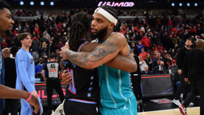 Jan 3, 2026; Chicago, Illinois, USA; Chicago Bulls guard Ayo Dosunmu (11) and Charlotte Hornets forward Miles Bridges (0) hug after a game at United Center. Mandatory Credit: Patrick Gorski-Imagn Images
