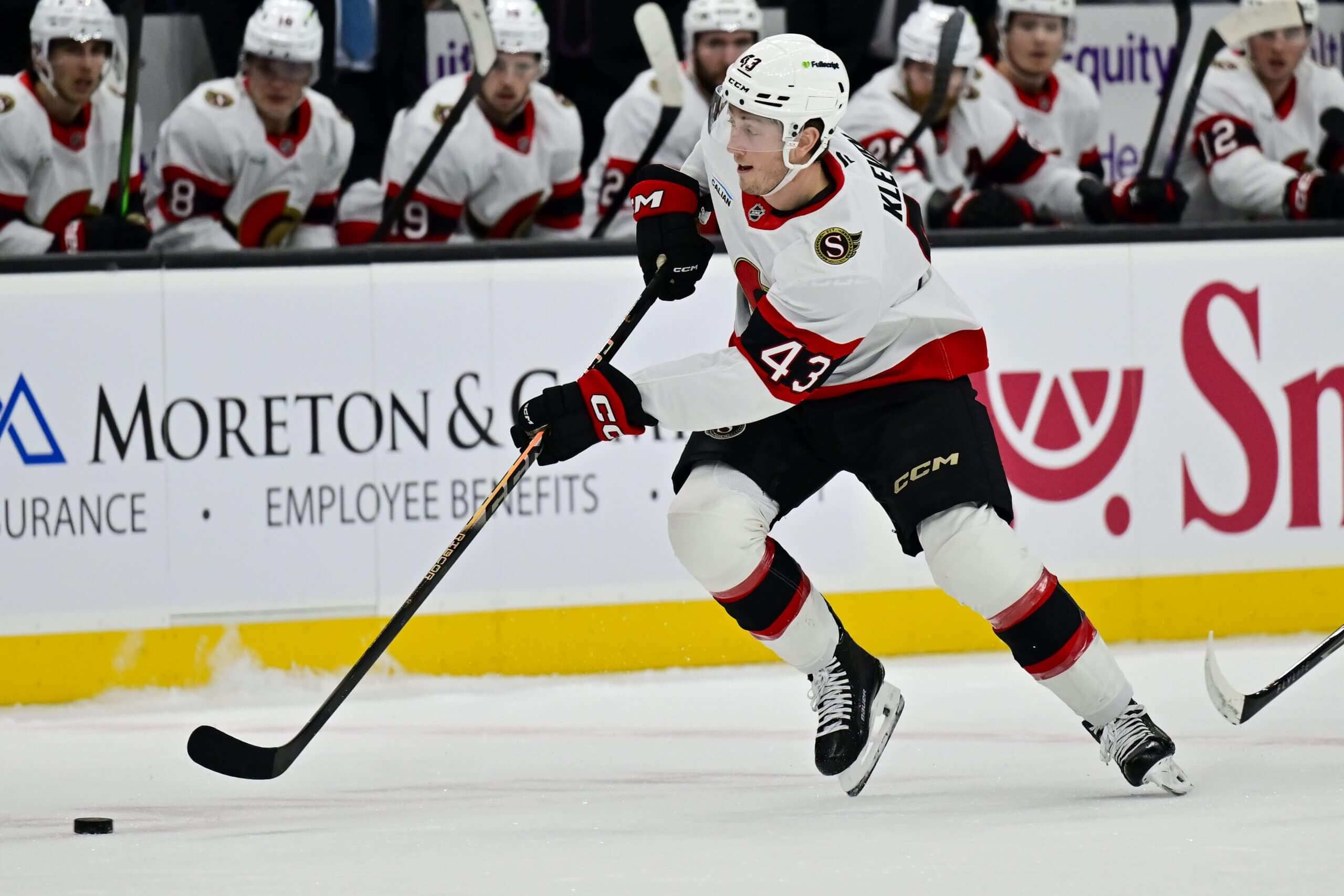 Tyler Kleven skates with the puck during a Senators game.