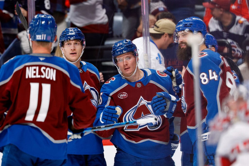 Colorado Avalanche left wing Victor Olofsson (95) celebrates his goal with defenseman Josh Manson (42) and defenseman Brent Burns (84) and center Brock Nelson (11) in the second period against the Washington Capitals at Ball Arena. Mandatory Credit: Isaiah J. Downing-Imagn Images