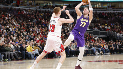 Jan 26, 2026; Chicago, Illinois, USA; Los Angeles Lakers guard Luka Doncic (77) shoots against Chicago Bulls guard Kevin Huerter (13) during the second half at United Center.