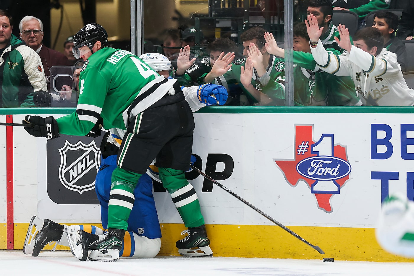 Dallas Stars defenseman Miro Heiskanen (4) ties up St. Louis Blues right wing Alexey...
