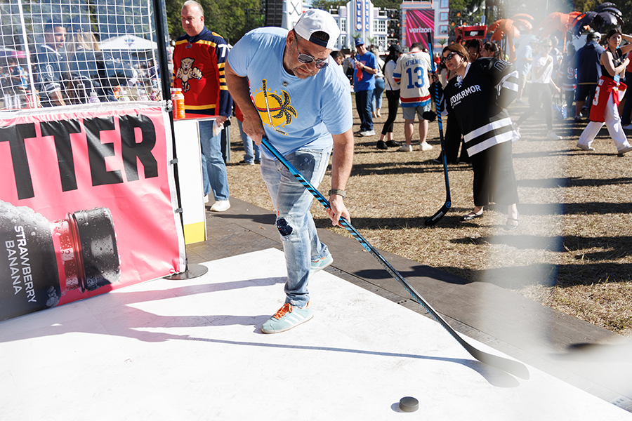 Cape Coral resident Charlie Smith shoots a puck at the Bodyarmor fan interactive at the 2026 Enterprise NHL PreGame Outdoor Fan Festival at LoanDepot Park in Miami, Friday, Jan. 2, 2026.