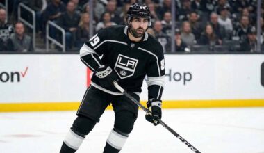 Los Angeles Kings forward Alex Tuch (89) skating on the ice in a black home jersey during an NHL game.