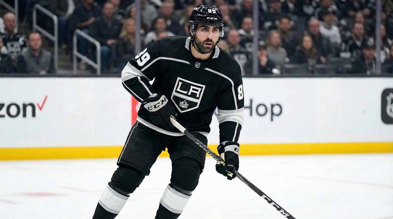 Los Angeles Kings forward Alex Tuch (89) skating on the ice in a black home jersey during an NHL game.