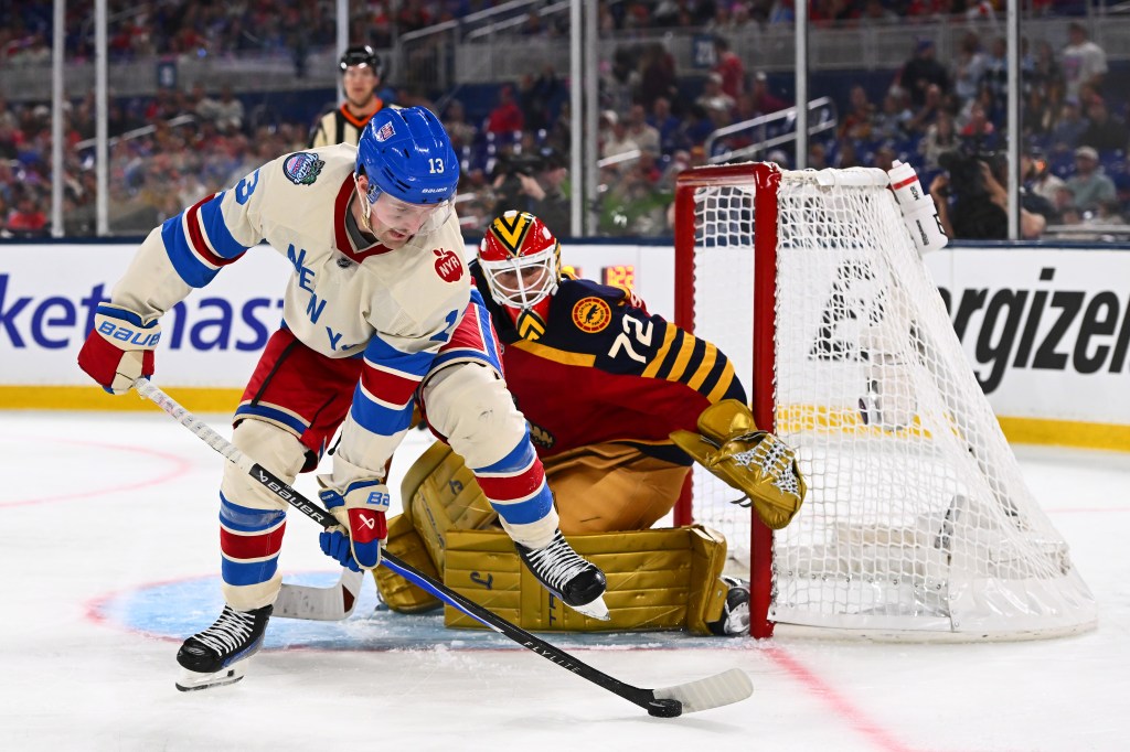 Alexis Lafreniere #13 of the New York Rangers controls the puck in front of Sergei Bobrovsky #72 of the Florida Panthers during the third period of the 2026 Discover NHL Winter Classic game between the New York Rangers and the Florida Panthers at loanDepot park on January 02, 2026 in Miami, Florida. 