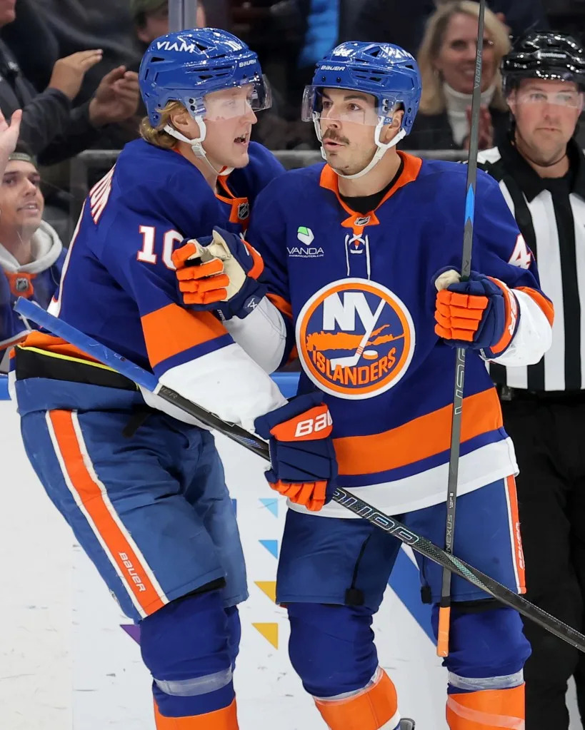 New York Islanders center Jean-Gabriel Pageau (44) celebrates his goal against the Minnesota Wild with right wing Simon Holmstrom (10) during the second period at UBS Arena. Brad Penner-Imagn Images