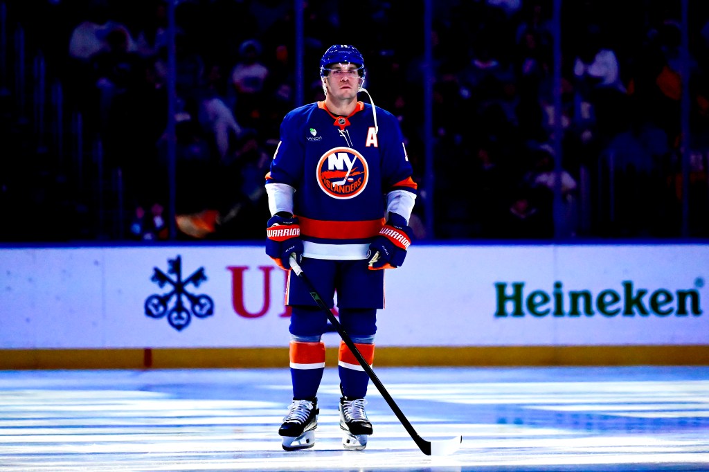 Bo Horvat #14 of the New York Islanders stands for the national anthem prior to the game against the New York Rangers.