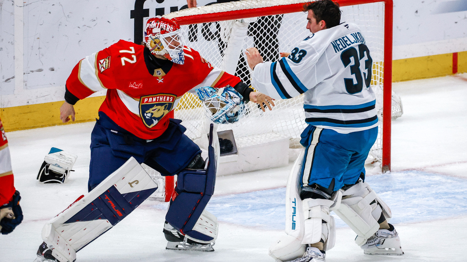 Florida Panthers goaltender Sergei Bobrovsky (72) and San Jose Sharks goaltender Alex Nedeljkovic (33) throw down