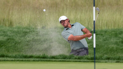 Jun 12, 2025; Oakmont, Pennsylvania, USA; Brooks Koepka plays a shot from a bunker on the eighth hole during the first round of the U.S. Open golf tournament.