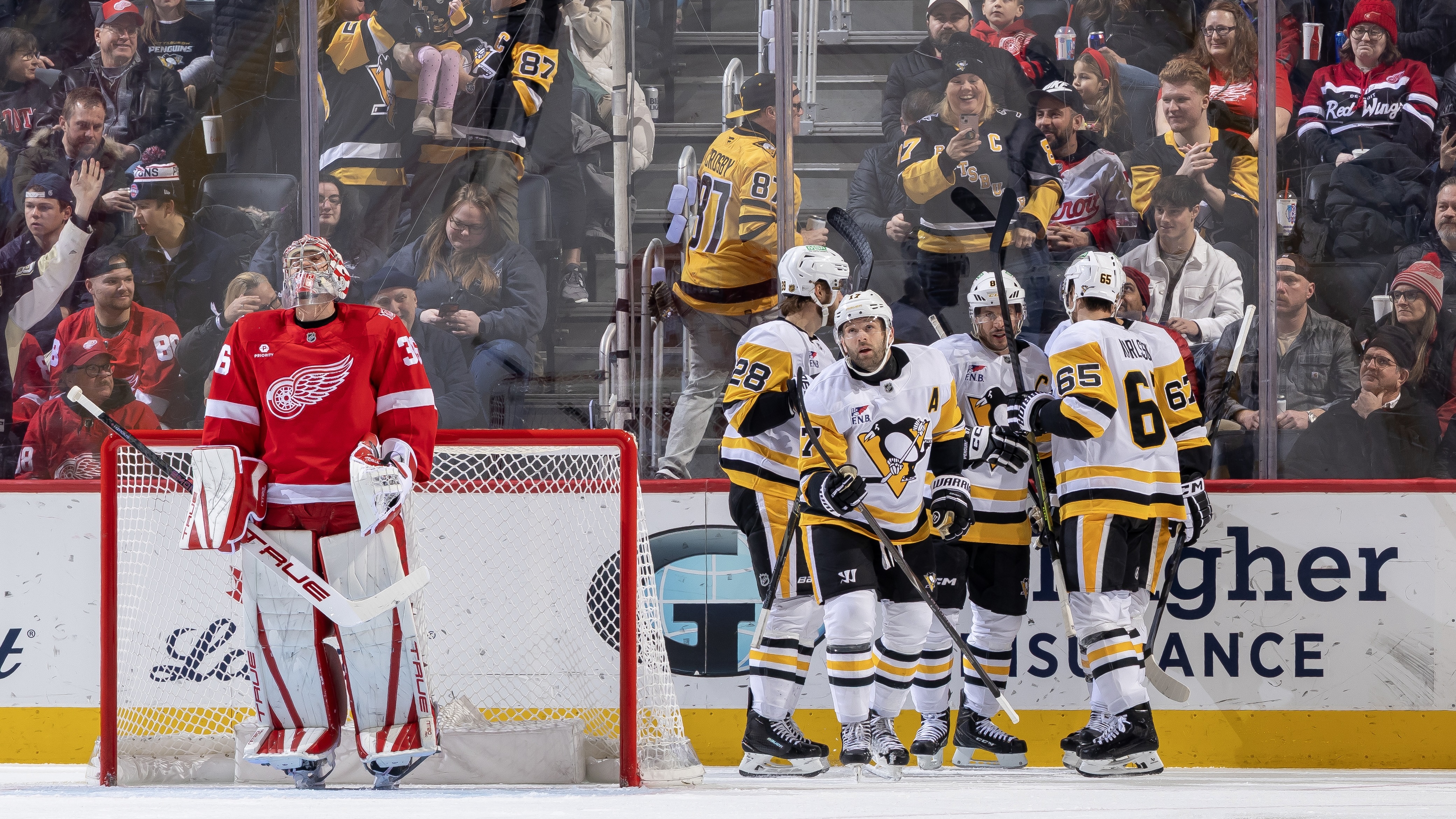 Bryan Rust celebrates his first-period goal with teammates today at Little Caesars Arena. Bryan Rust celebrates his first-period goal with teammates today at Little Caesars Arena.