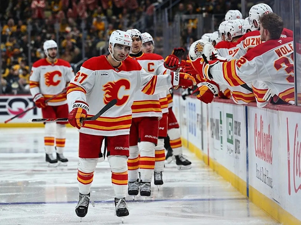  Flames forward Matt Coronato celebrates his goal against the Penguins.