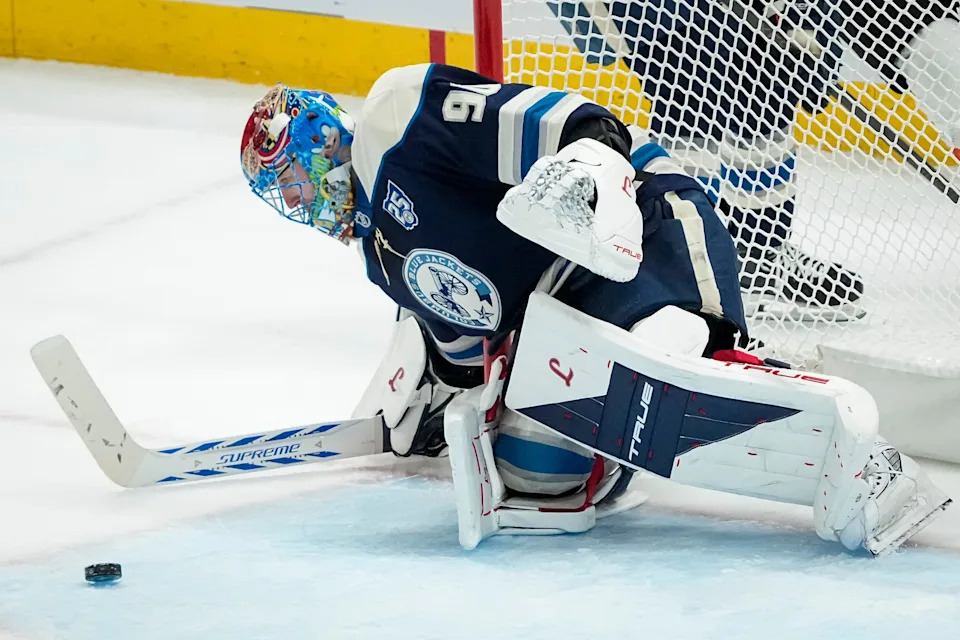 Columbus Blue Jackets goaltender Elvis Merzlikins (90) stops a shot during the second period of the NHL hockey game against the Philadelphia Flyers at Nationwide Arena in Columbus on Jan. 28, 2026.