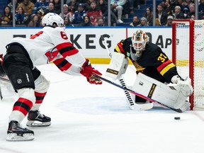 Vancouver Canucks goaltender Kevin Lankinen stops a shot on goal.