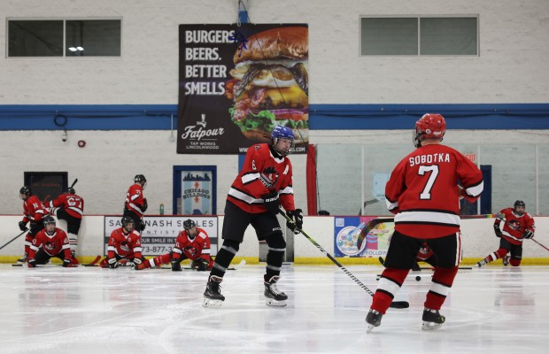 Zack Dessent, center, and Andrew Sobotka warm up with the Chicago Pride Hockey team for a game against the Chicago Aces at the American Heartland Ice Arena, Jan. 15, 2026, in Lincolnwood. (John J. Kim/Chicago Tribune)