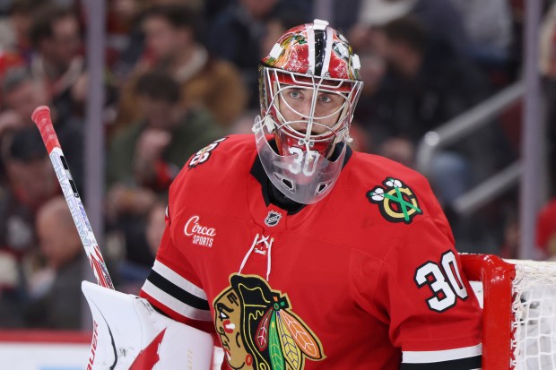 Spencer Knight of the Chicago Blackhawks looks on during the first period against the Edmonton Oilers at the United Center on Jan. 12, 2026. (Geoff Stellfox/Getty Images)