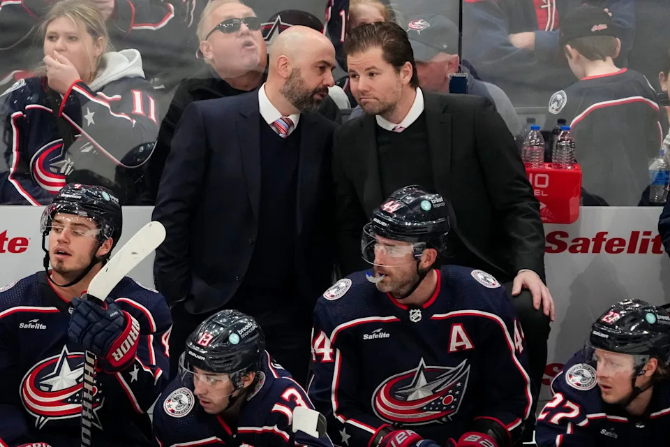 Blue Jackets head coach Pascal Vincent (left) talks to assistant Steve McCarthy during the second period of a Jan. 15, 2024, game against the Canucks at Nationwide Arena.