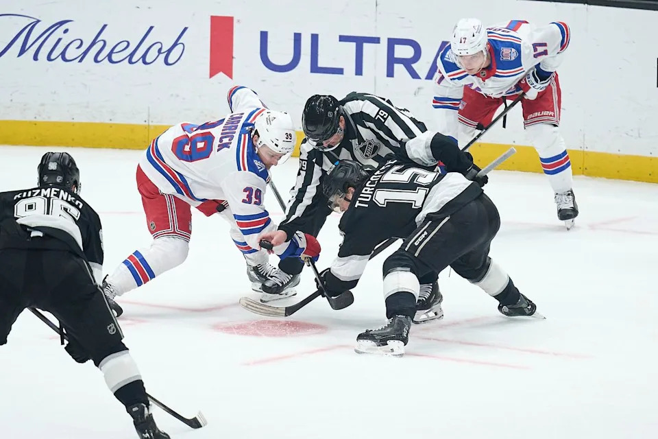 The Los Angeles Kings center Alex Turcotte (15) does a face off against the New York Rangers at the Crypto Arena on January 20th, 2026 in Los Angeles California.