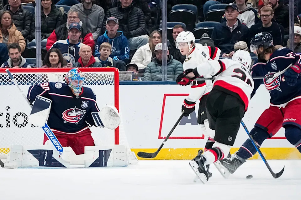Columbus Blue Jackets goaltender Elvis Merzlikins (90) faces a shot from Ottawa Senators right wing Claude Giroux (28) during the first period of the NHL hockey game at Nationwide Arena in Columbus on Jan. 20, 2026.