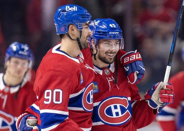  Montreal Canadiens’ Joe Veleno, left, gives teammate Alexandre Carrier a hug after a game against the Vancouver Canucks at the Bell Centre in Montreal on Monday January 12, 2026. Carrier scored two goals in the game.