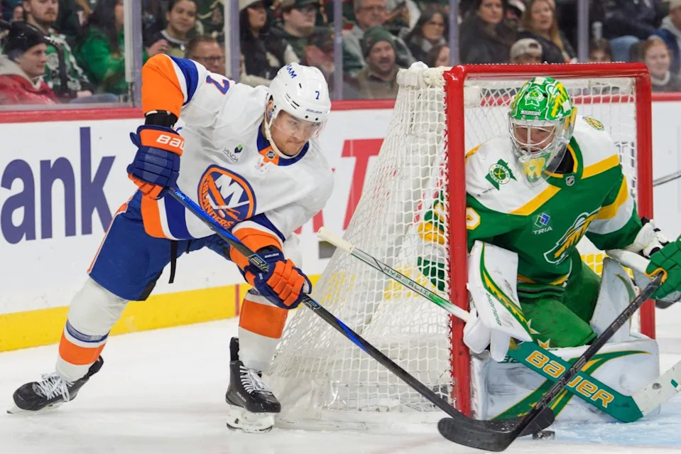 New York Islanders right wing Maxim Tsyplakov (7) tries a wrap around shot on Minnesota Wild goaltender Filip Gustavsson (32) in the third period at Grand Casino Arena. Matt Blewett-Imagn Images