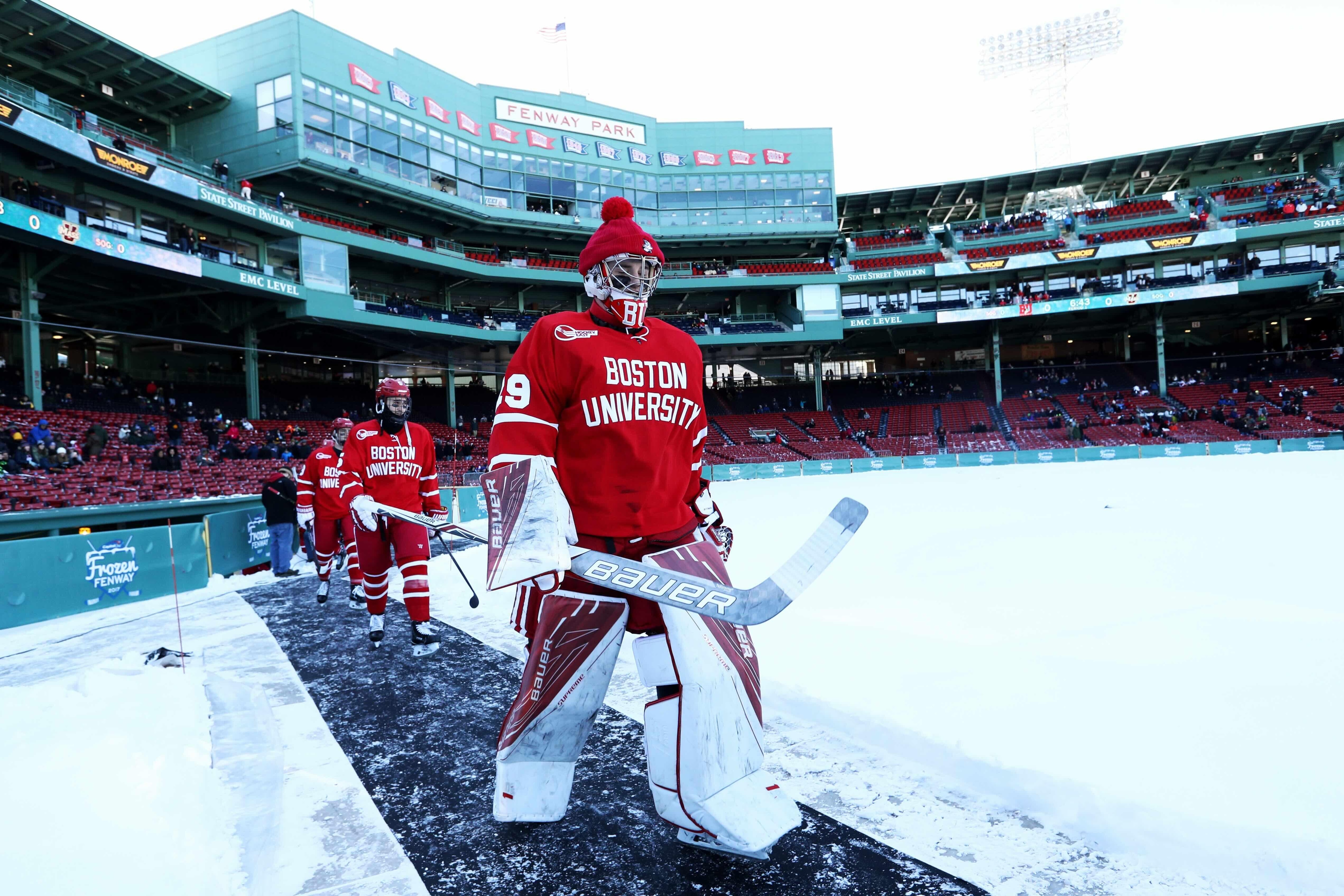 Boston University goaltender Jake Oettinger leads the Terriers into Fenway Park in 2017