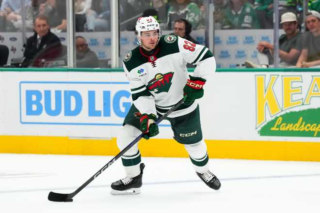 Minnesota Wild v Dallas Stars DALLAS, TEXAS - SEPTEMBER 25: David Spacek #82 of the Minnesota Wild controls the puck during the second period of a preseason game against the Dallas Stars at American Airlines Center on September 25, 2024 in Dallas, Texas. (Photo by Sam Hodde/Getty Images)