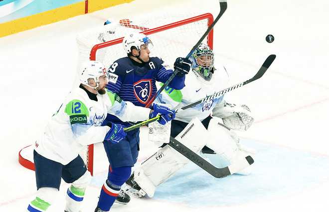 France v Slovenia - 2025 IIHF Ice Hockey World Championship STOCKHOLM, SWEDEN - MAY 19: Louis Boudon #29 of Team France in action over Lukas Horak #61 and Nik Simsic #12 of Team Slovenia during the 2025 IIHF Ice Hockey World Championship match between France and Slovenia at Avicii Arena on May 19, 2025 in Stockholm, Sweden. (Photo by Xavier Laine/Getty Images)