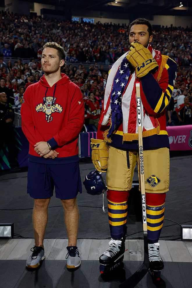MIAMI, FLORIDA - JANUARY 2: Seth Jones #3 of the Florida Panthers and teammate Matthew Tkachuk #19 stand at attention during the singing of the National Anthem during the 2026 Discover NHL Winter Classic where they will meet the New York Rangers at LoanDepot Park on January 2, 2026 in Miami, Florida. (Photo by Eliot J. Schechter/NHLI via Getty Images)