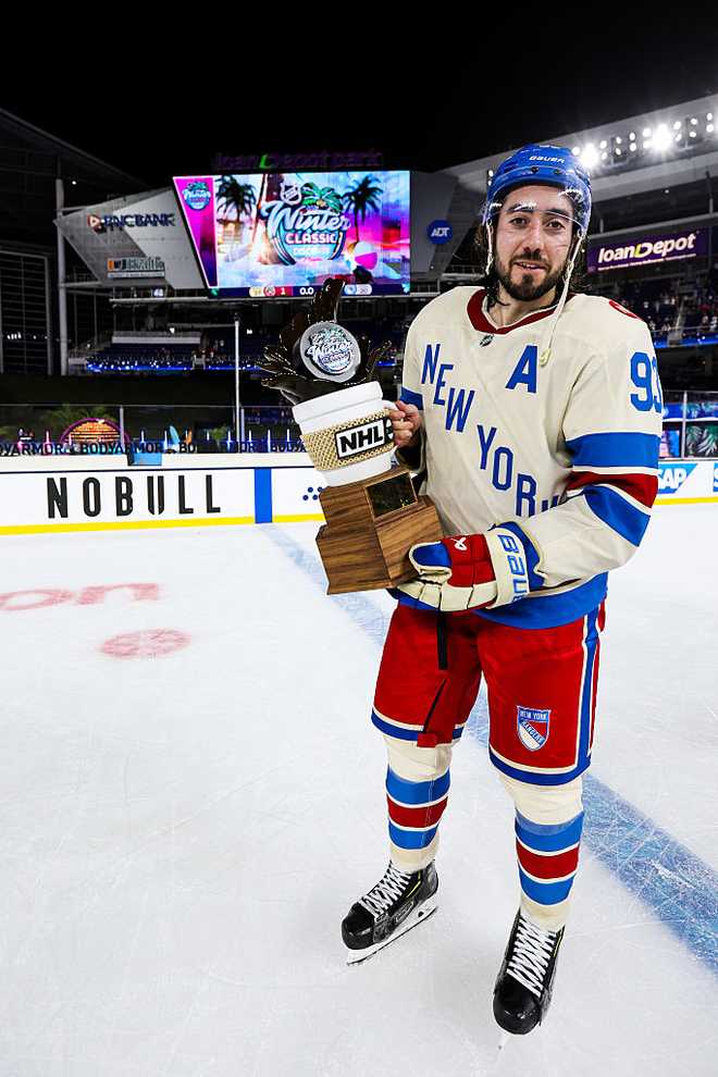 MIAMI, FLORIDA - JANUARY 02: Mika Zibanejad #93 of the New York Rangers poses with his MVP trophy after defeating the Florida Panthers 5-1 in the 2026 Discover NHL Winter Classic at loanDepot Park on January 2, 2026 in Miami, Florida. (Photo by Jared Silber/NHLI via Getty Images)