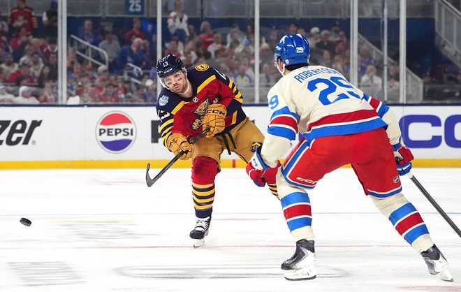 MIAMI, FLORIDA - JANUARY 02: Sam Reinhart #13 of the Florida Panthers shoots the puck past Matthew Robertson #29 of the New York Rangers during the first period of the 2026 Discover NHL Winter Classic game between the New York Rangers and the Florida Panthers at loanDepot park on January 02, 2026 in Miami, Florida. (Photo by Brian Babineau/NHLI via Getty Images)