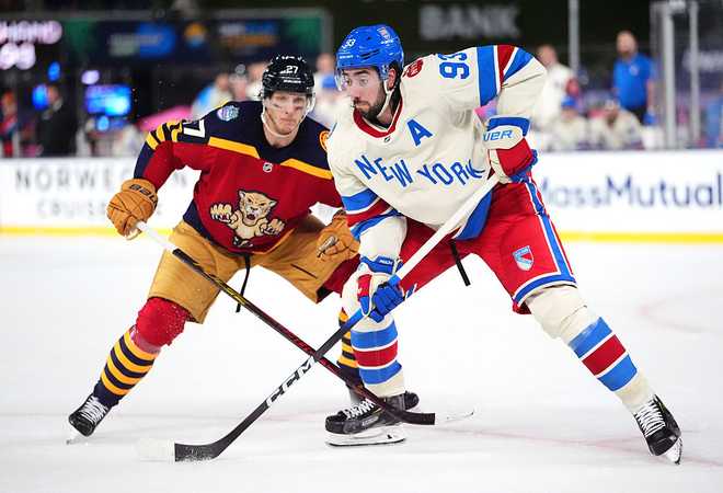 MIAMI, FLORIDA - JANUARY 02: Mika Zibanejad #93 of the New York Rangers and Eetu Luostarinen #27 of the Florida Panthers skate for position during the third period of the 2026 Discover NHL Winter Classic game between the New York Rangers and the Florida Panthers at loanDepot Park on January 02, 2026 in Miami, Florida. (Photo by Brian Babineau/NHLI via Getty Images)