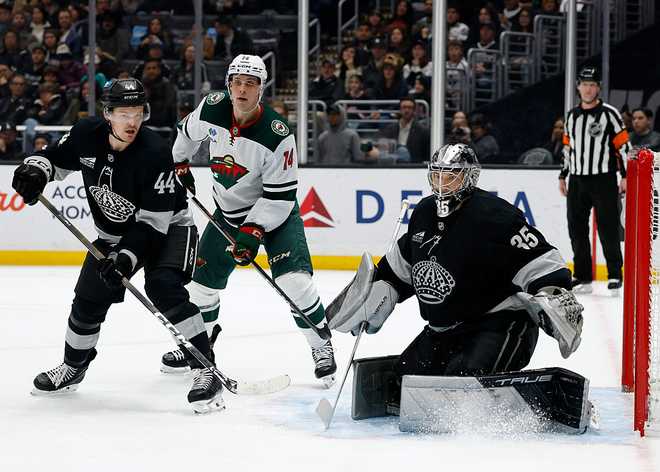 Minnesota Wild v Los Angeles Kings LOS ANGELES, CALIFORNIA - JANUARY 03: Darcy Kuemper #35 of the Los Angeles Kings in goal in front of Joel Eriksson Ek #14 of the Minnesota Wild and Mikey Anderson #44 during a 5-4 shootout win over the Wild at Crypto.com Arena on January 03, 2026 in Los Angeles, California. (Photo by Harry How/Getty Images)