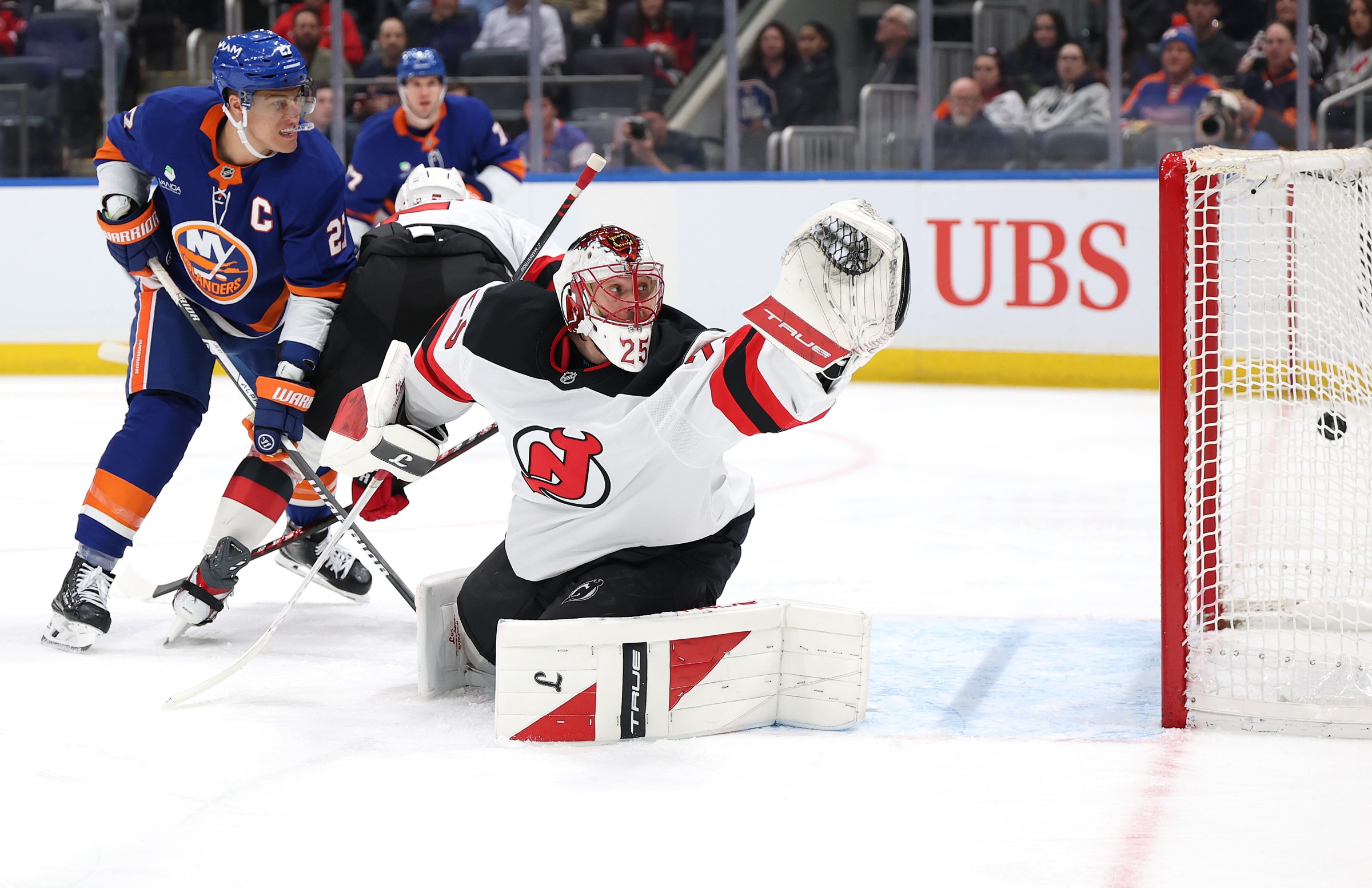 ELMONT, NEW YORK - JANUARY 06: Jacob Markstrom #25 of the New Jersey Devils gives up a goal by Anthony Duclair #11 of the New York Islanders in the second period making it a hat trick during their game at UBS Arena on January 06, 2026 in Elmont, New York. (Photo by Al Bello/Getty Images)
