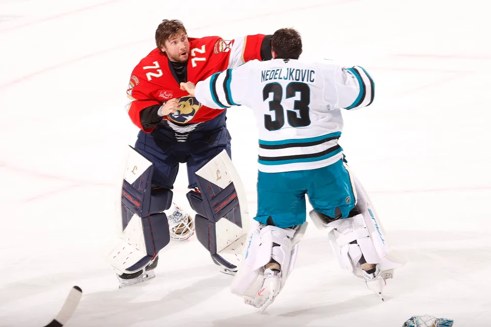 Goaltender Sergei Bobrovsky #72 of the Florida Panthers fights with Goaltender Alex Nedeljkovic #33 of the San Jose Sharks at the Amerant Bank Arena on January 19, 2026 in Sunrise, Florida.