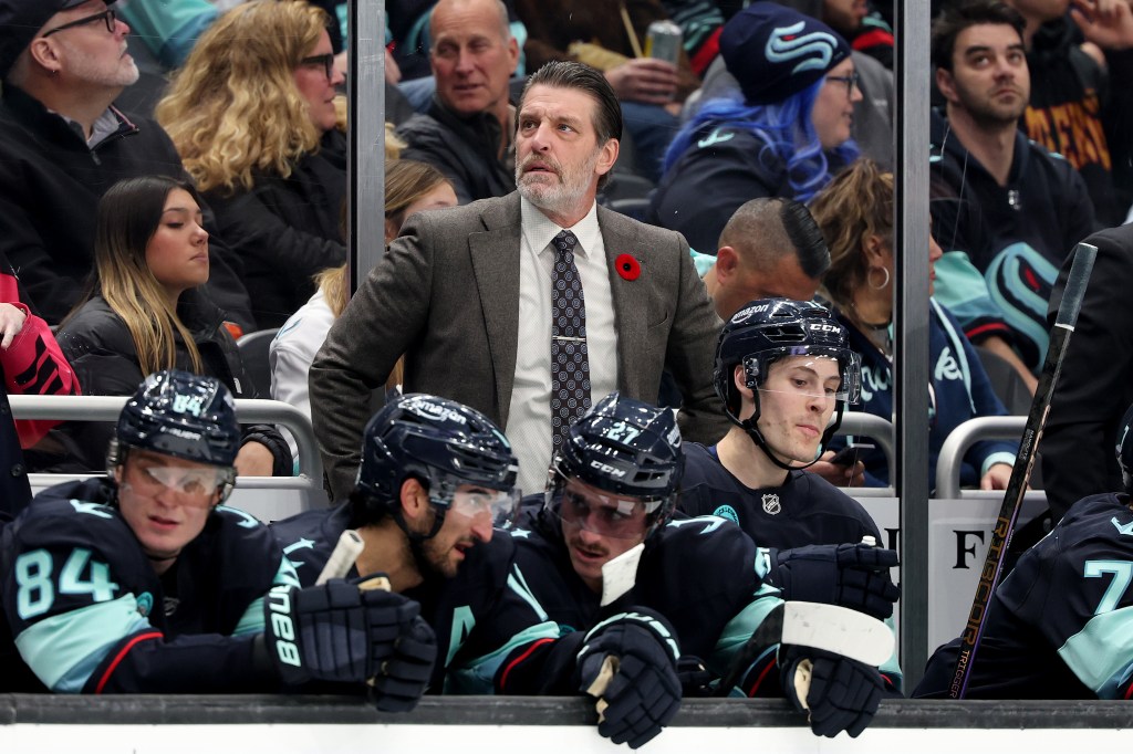 Seattle Kraken head coach Lane Lambert watching the game from the bench.