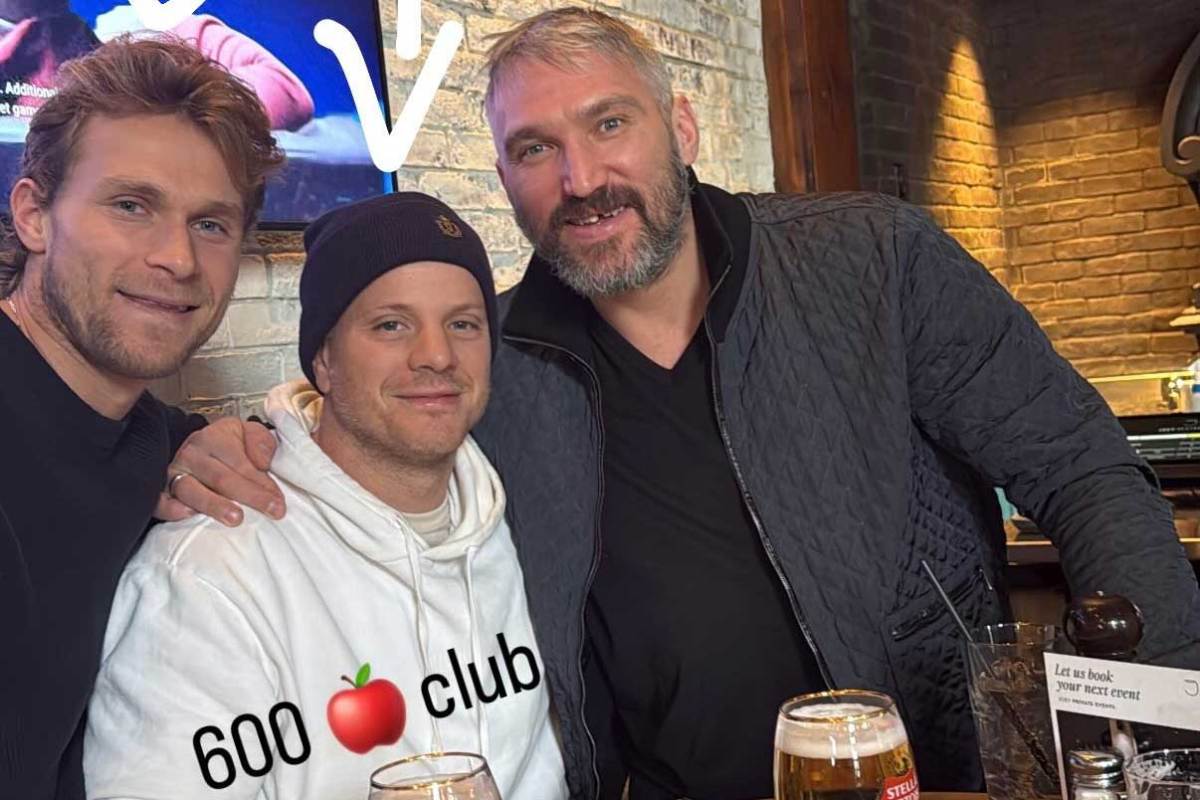 Alex Ovechkin and Capitals players celebrate John Carlson’s 600-assist milestone in Calgary