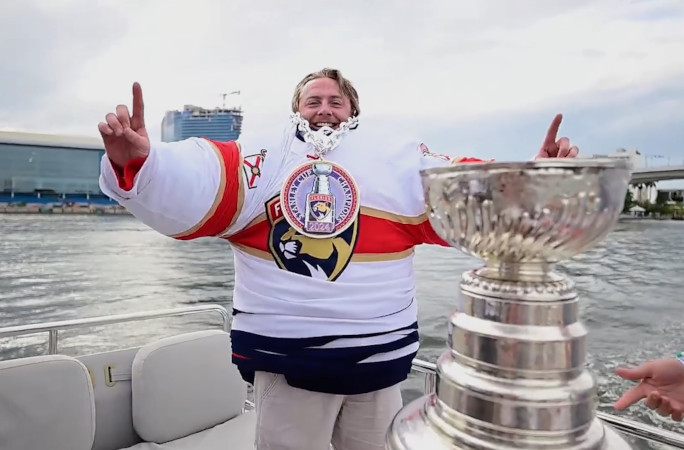 Dakota giving a thumbs up with the cup