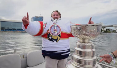 Dakota King with 40 jerseys on next to the Stanley Cup