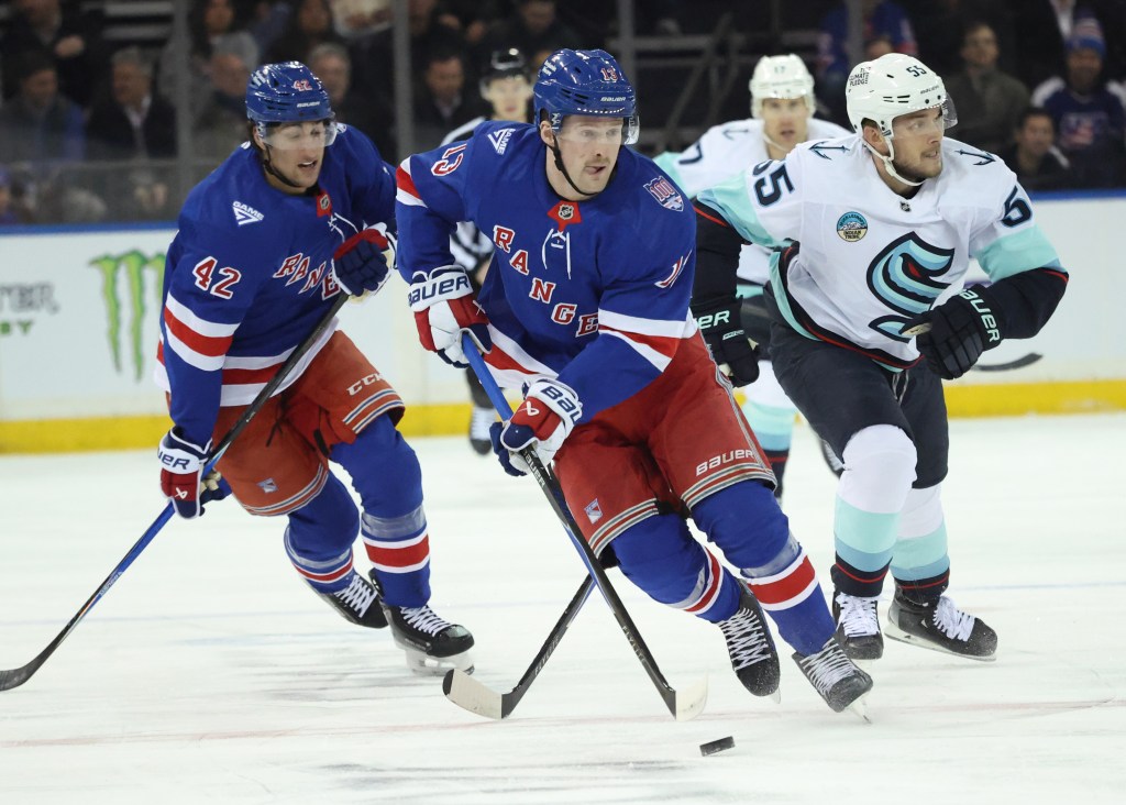 New York Rangers left wing Alexis Lafrenière #13, with the puck in the 1st period.
