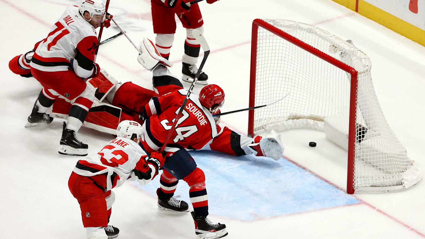 Jan 31, 2026; Washington, District of Columbia, USA; Washington Capitals right wing Justin Sourdif (34) scores the game-winning goal during overtime against the Carolina Hurricanes at Capital One Arena. Mandatory Credit: Daniel Kucin Jr.-Imagn Images