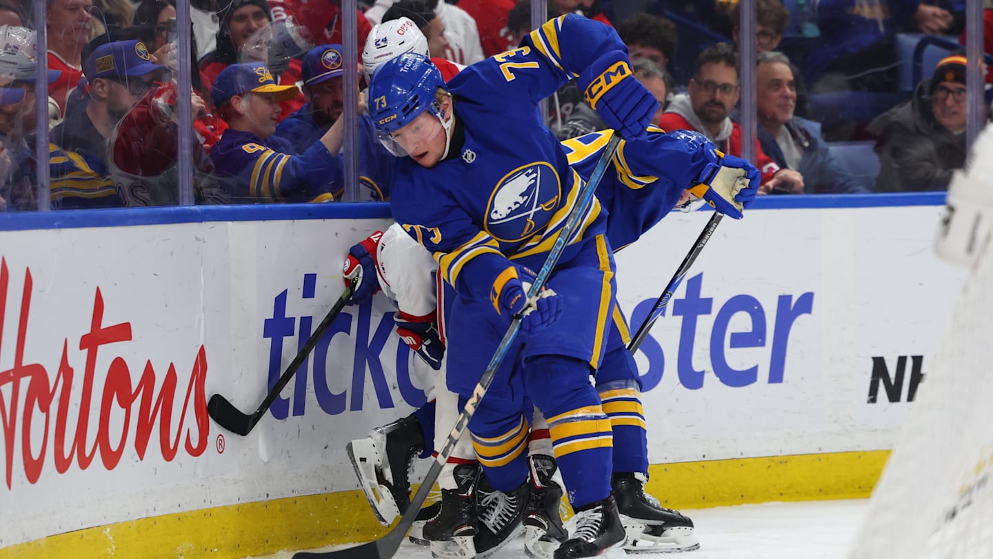 Jan 31, 2026; Buffalo, New York, USA;  Buffalo Sabres defenseman Zach Metsa (73) clears the puck from behind the net during the first period against the Montréal Canadiens at KeyBank Center. Mandatory Credit: Timothy T. Ludwig-Imagn Images