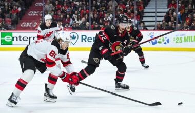 Jan 31, 2026; Ottawa, Ontario, CAN; New Jersey Devils right wing Arseny Gritsyuk (81) reaches put for the puck against Ottawa Senators defenseman Thomas Chabot (72) during the second period at Canadian Tire Centre. Mandatory Credit: David Kirouac-Imagn Images