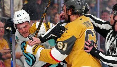 Jan 31, 2026; Las Vegas, Nevada, USA; Vegas Golden Knights right wing Mark Stone (61) grabs Seattle Kraken defenseman Ryan Lindgren (55) during the third period at T-Mobile Arena. Mandatory Credit: Stephen R. Sylvanie-Imagn Images
