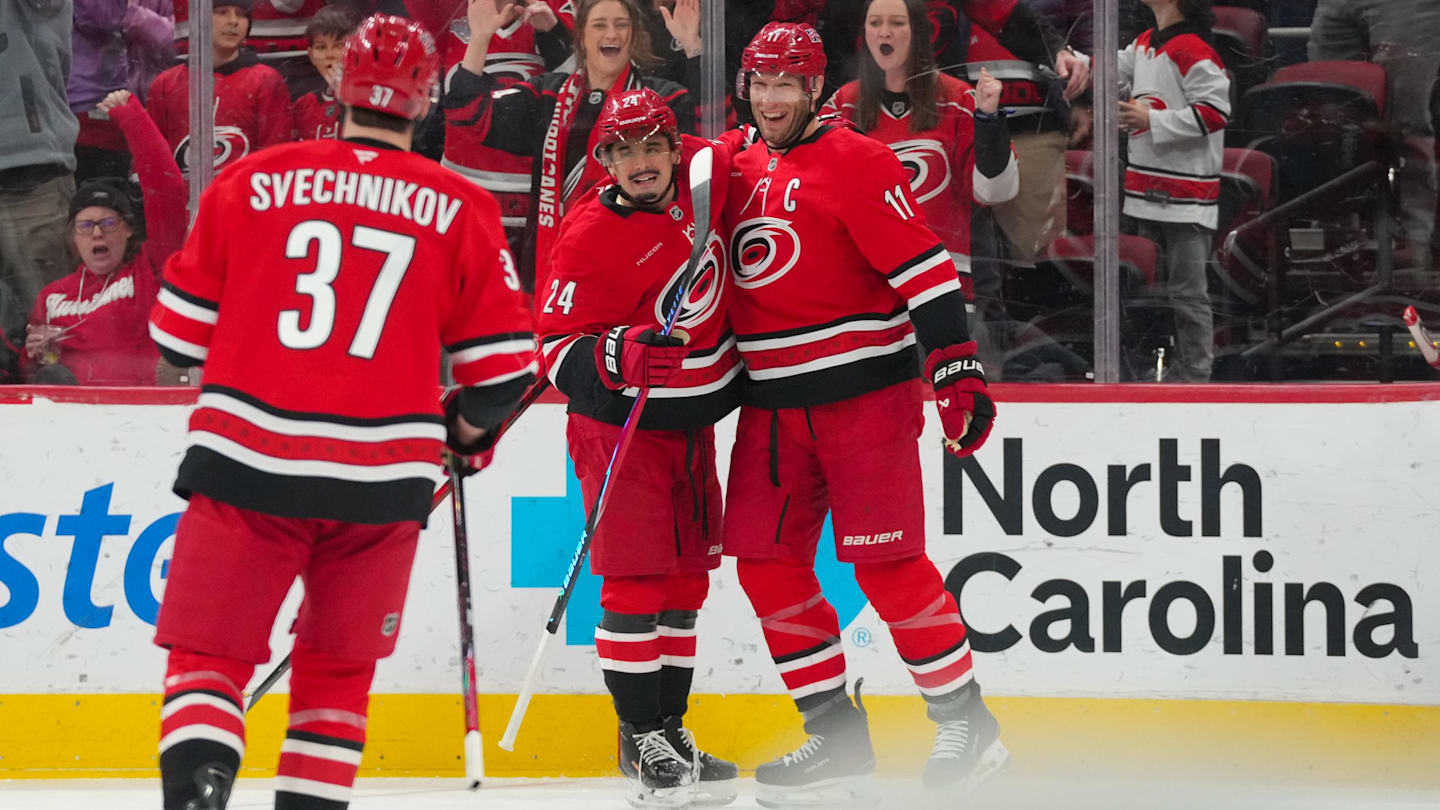 Feb 1, 2026; Raleigh, North Carolina, USA; Carolina Hurricanes center Jordan Staal (11) celebrates his goal with center Seth Jarvis (24) against the Los Angeles Kings during the first period at Lenovo Center. Mandatory Credit: James Guillory-Imagn Images